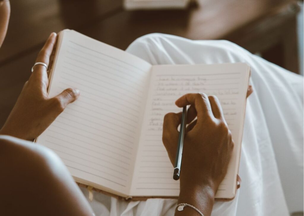 Working woman understanding perimenopause symptoms through menstrual cycle tracking and journaling.